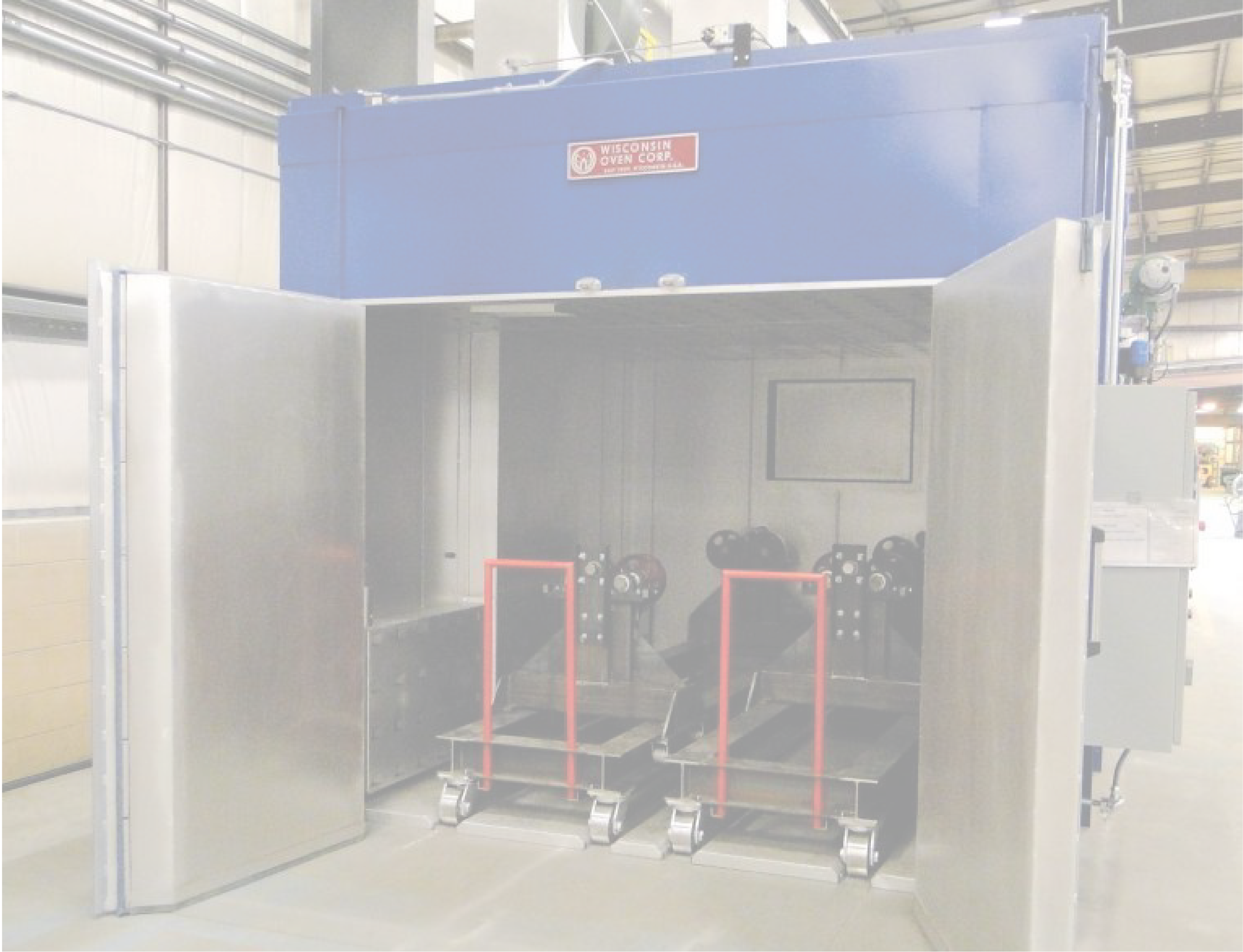 Large industrial oven with composite parts inside.